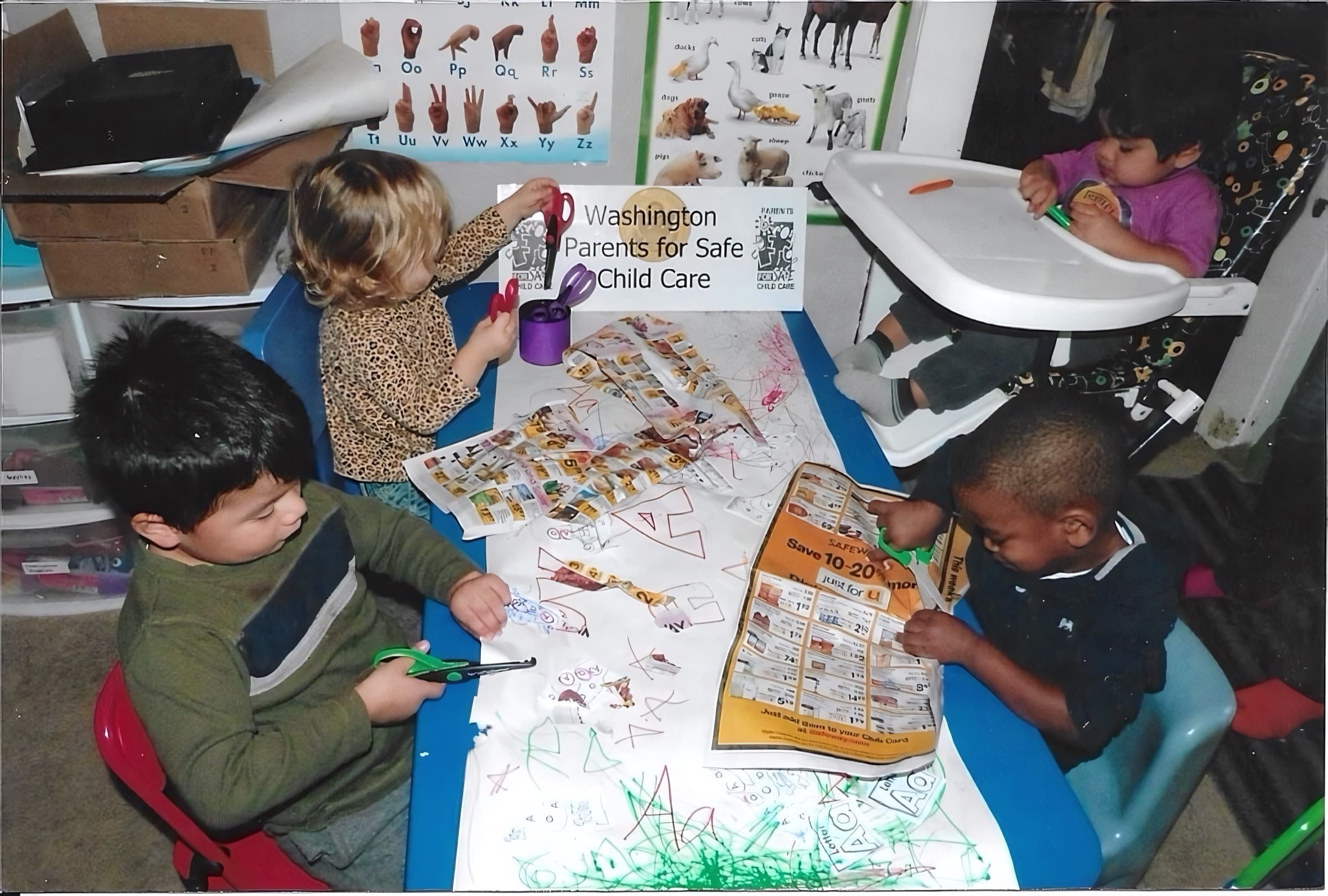 Children doing arts and crafts at a Parents for Safe Child Care program
